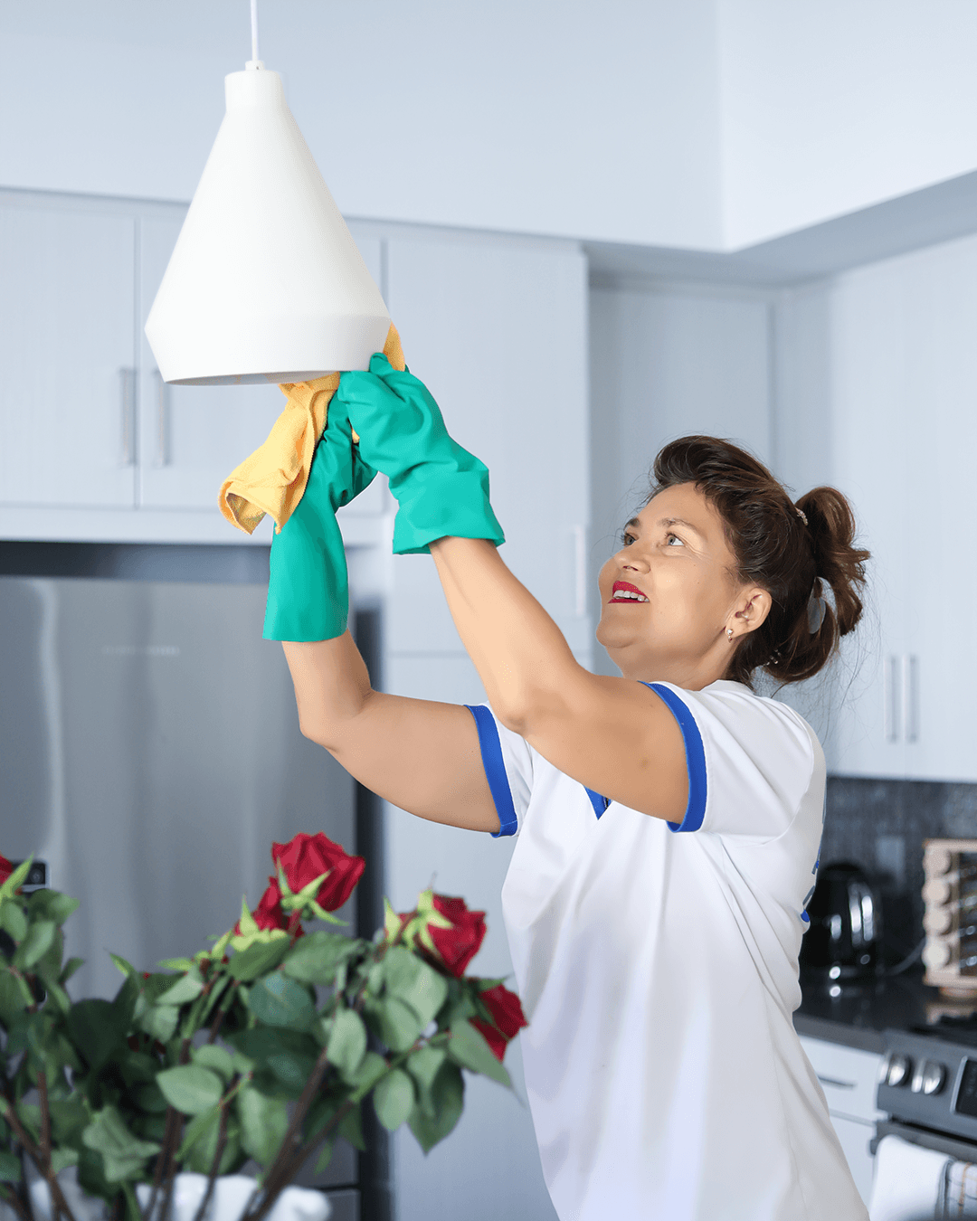 Meticulous dusting of high-reach surfaces by our cleaning team
